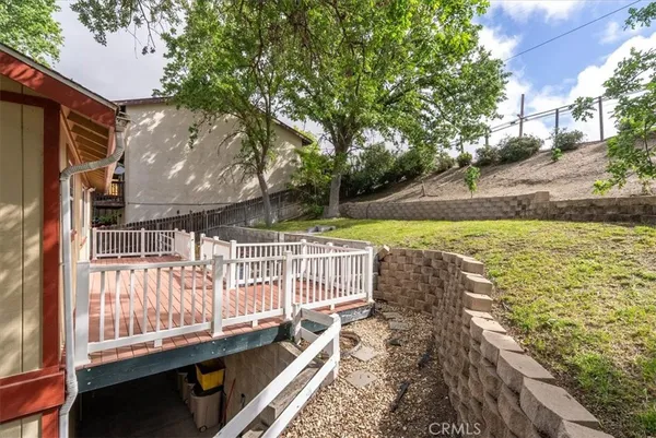a view of a balcony with wooden floor