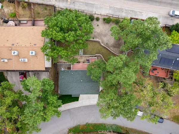 an aerial view of a house with a garden