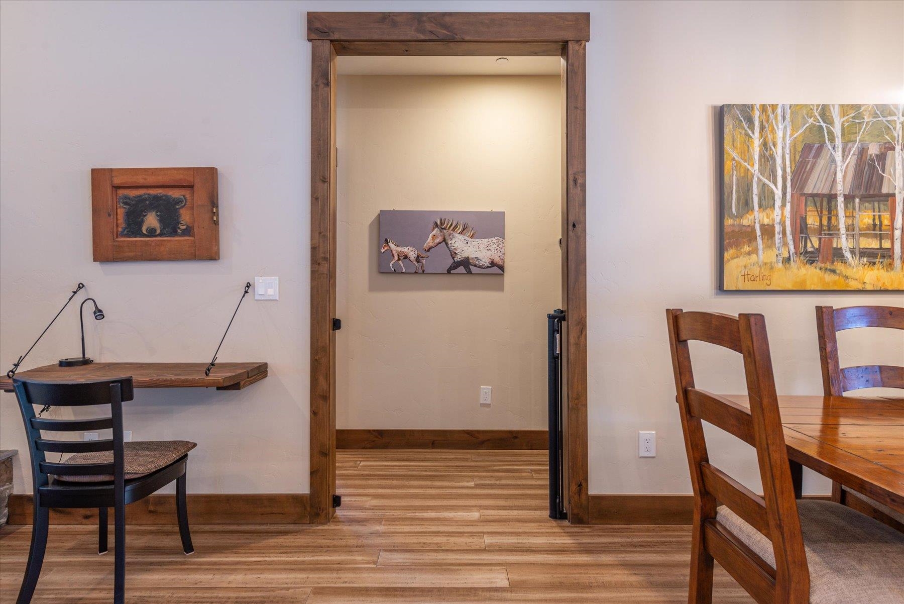 13846 Pathway Avenue Truckee, CA 96161 - Photo 12 of 28 a view of a hallway with chairs and a potted plant on a table and chair with wooden floor