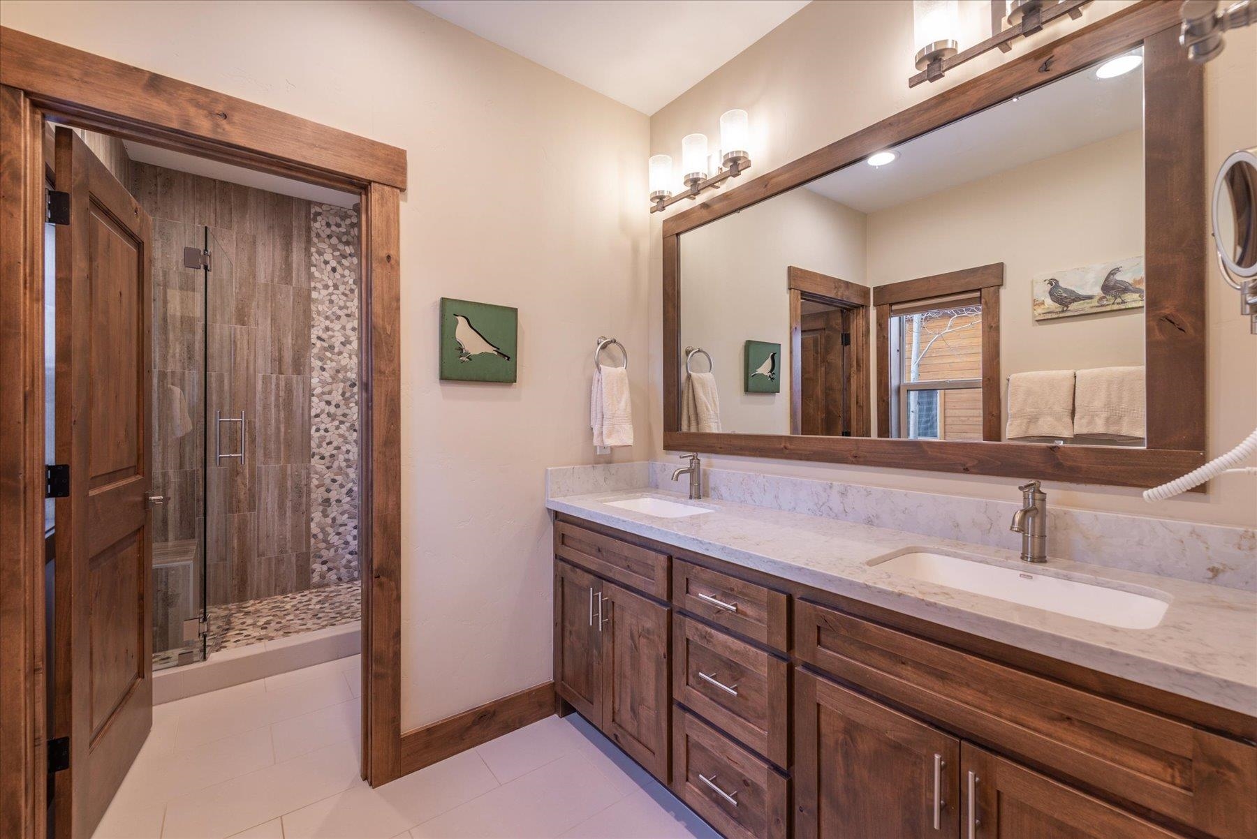 13846 Pathway Avenue Truckee, CA 96161 - Photo 15 of 28 a bathroom with a double vanity sink and a mirror