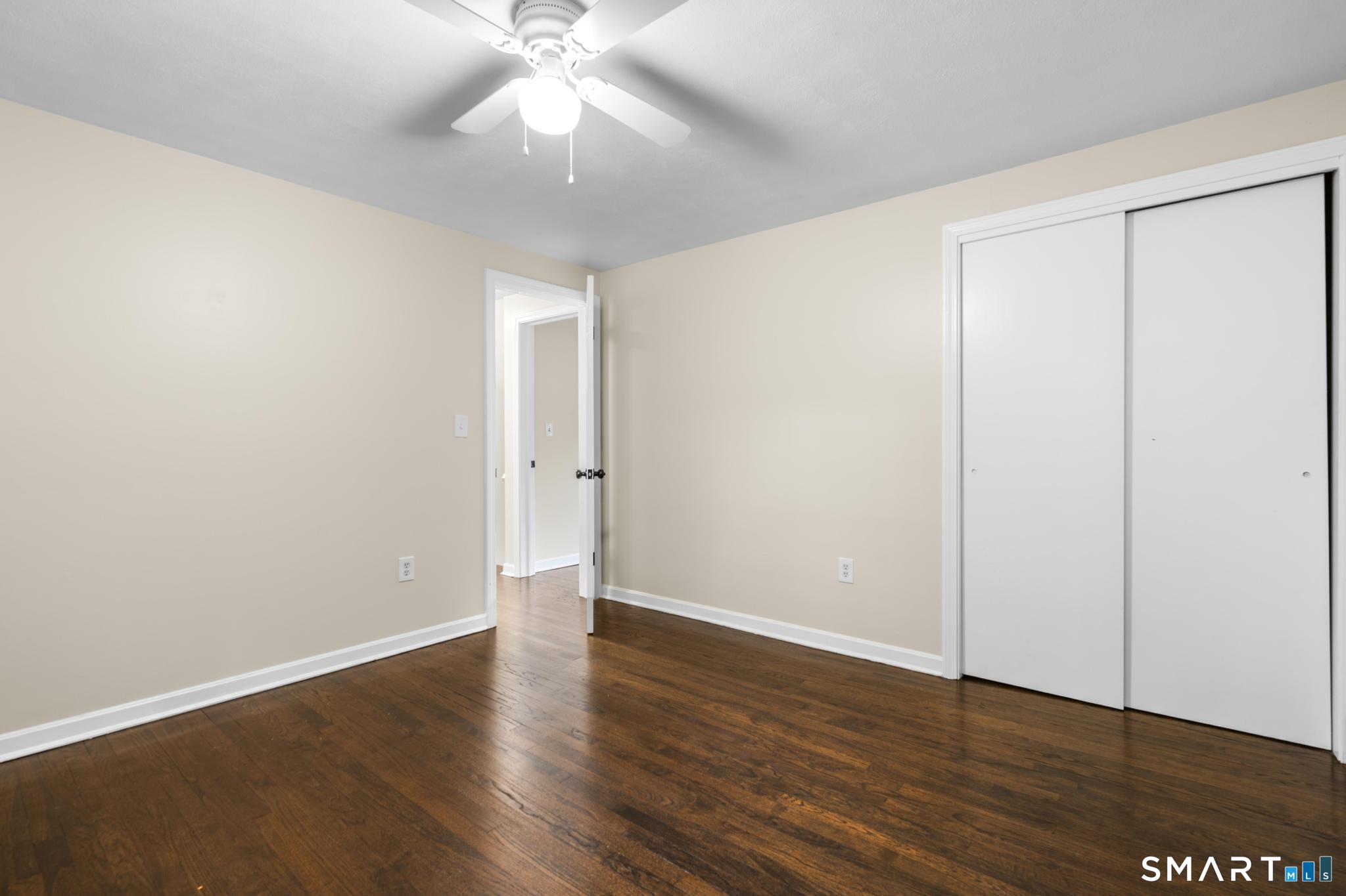7 Sycamore Terrace Windham, CT 06280 - Photo 22 of 40 an empty room with wooden floor and windows