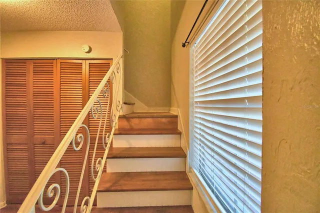 a view of a building with wooden floor and windows