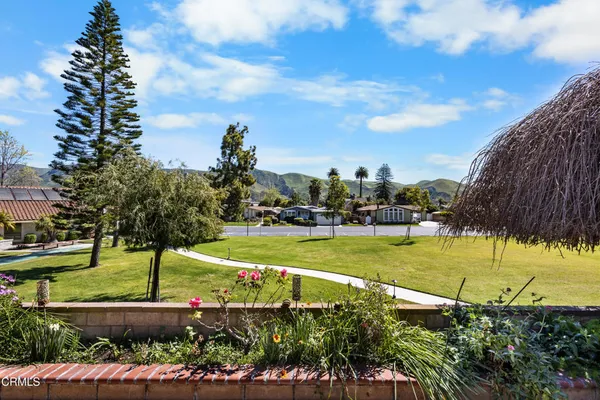 a view of a golf course with a lake view