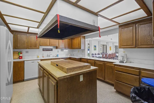 a kitchen that has a sink and a stove in it