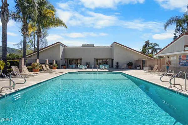 a front view of house with yard and seating area