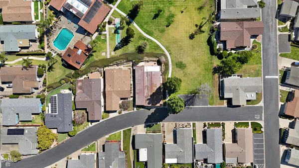 an aerial view of houses with outdoor space
