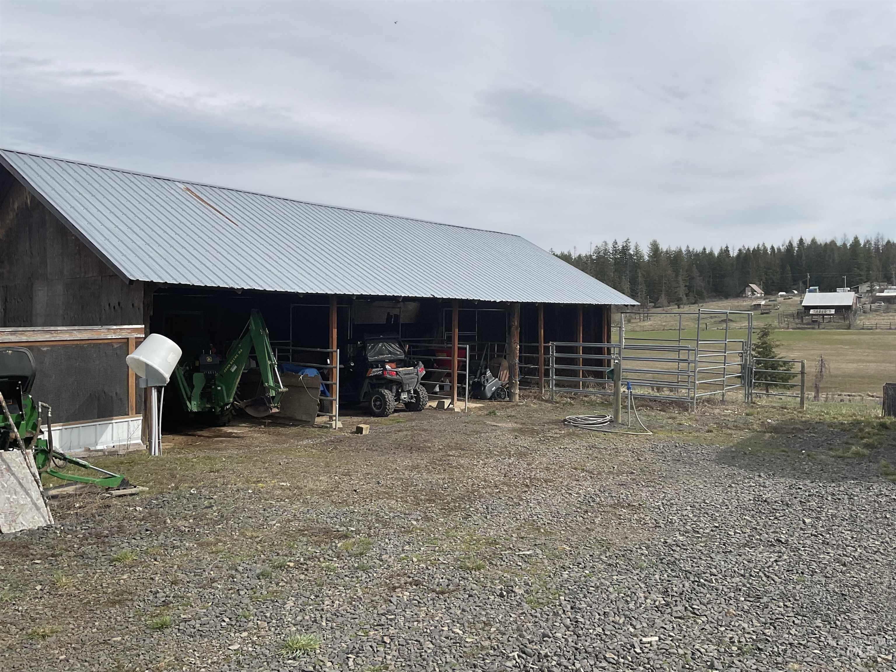 10749 Upper Fords Creek Road Orofino, ID 83544 - Photo 27 of 45 View of outbuilding featuring a carport and an exterior structure