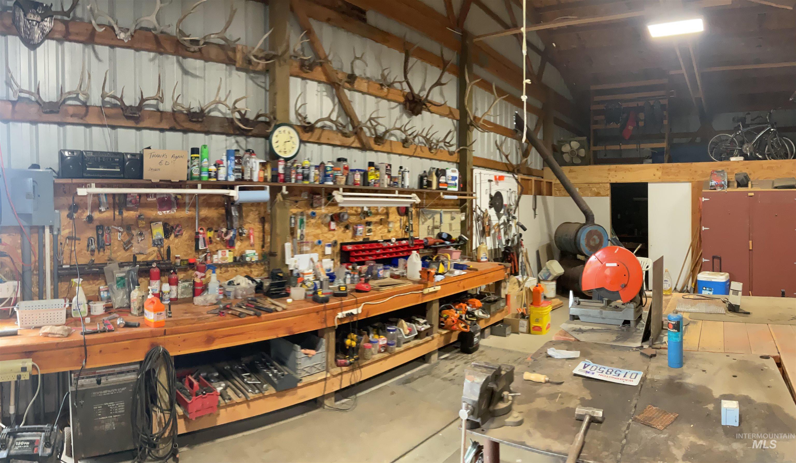 10749 Upper Fords Creek Road Orofino, ID 83544 - Photo 28 of 45 Miscellaneous room featuring a workshop area and vaulted ceiling