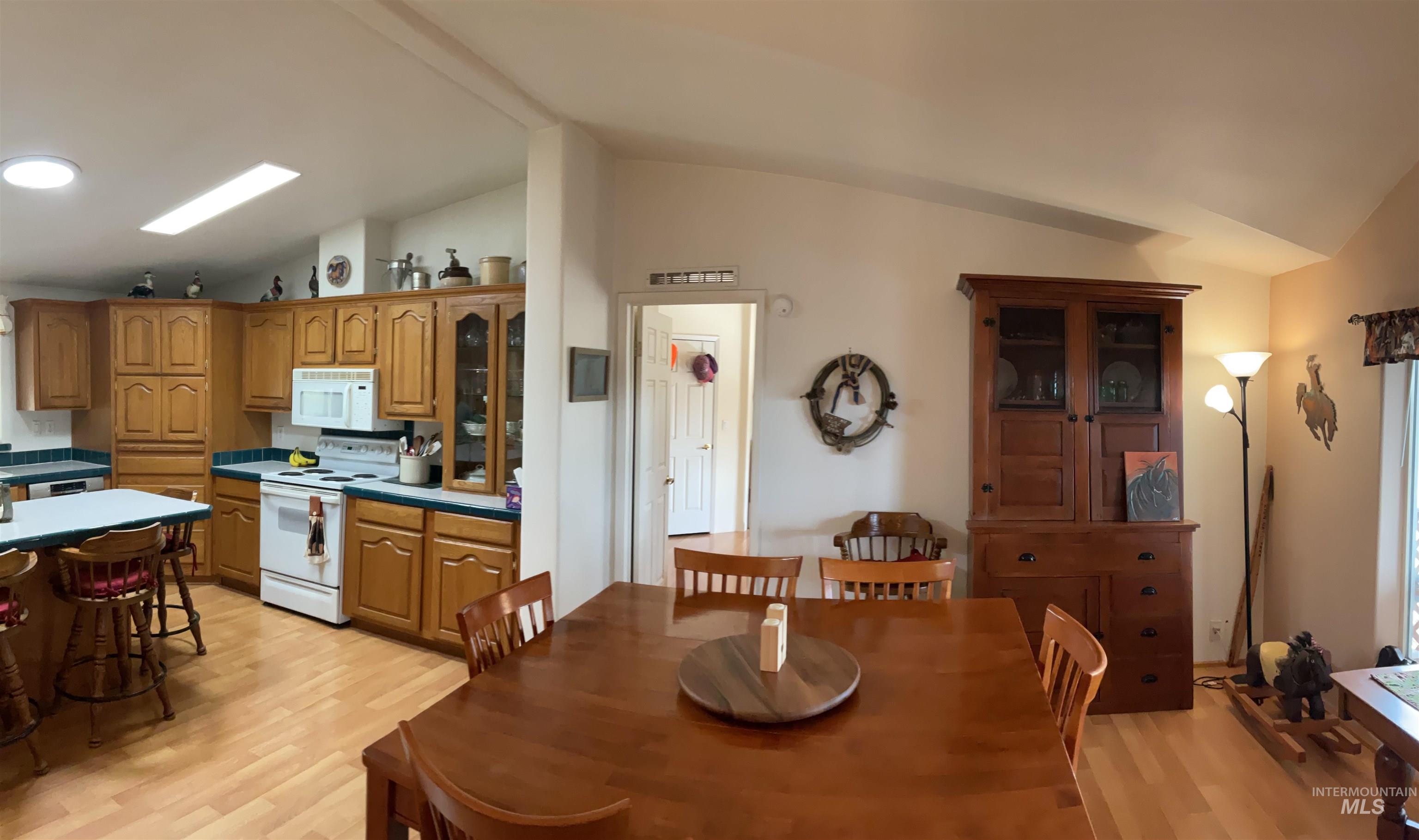 10749 Upper Fords Creek Road Orofino, ID 83544 - Photo 36 of 45 Dining space featuring light wood-style floors and vaulted ceiling