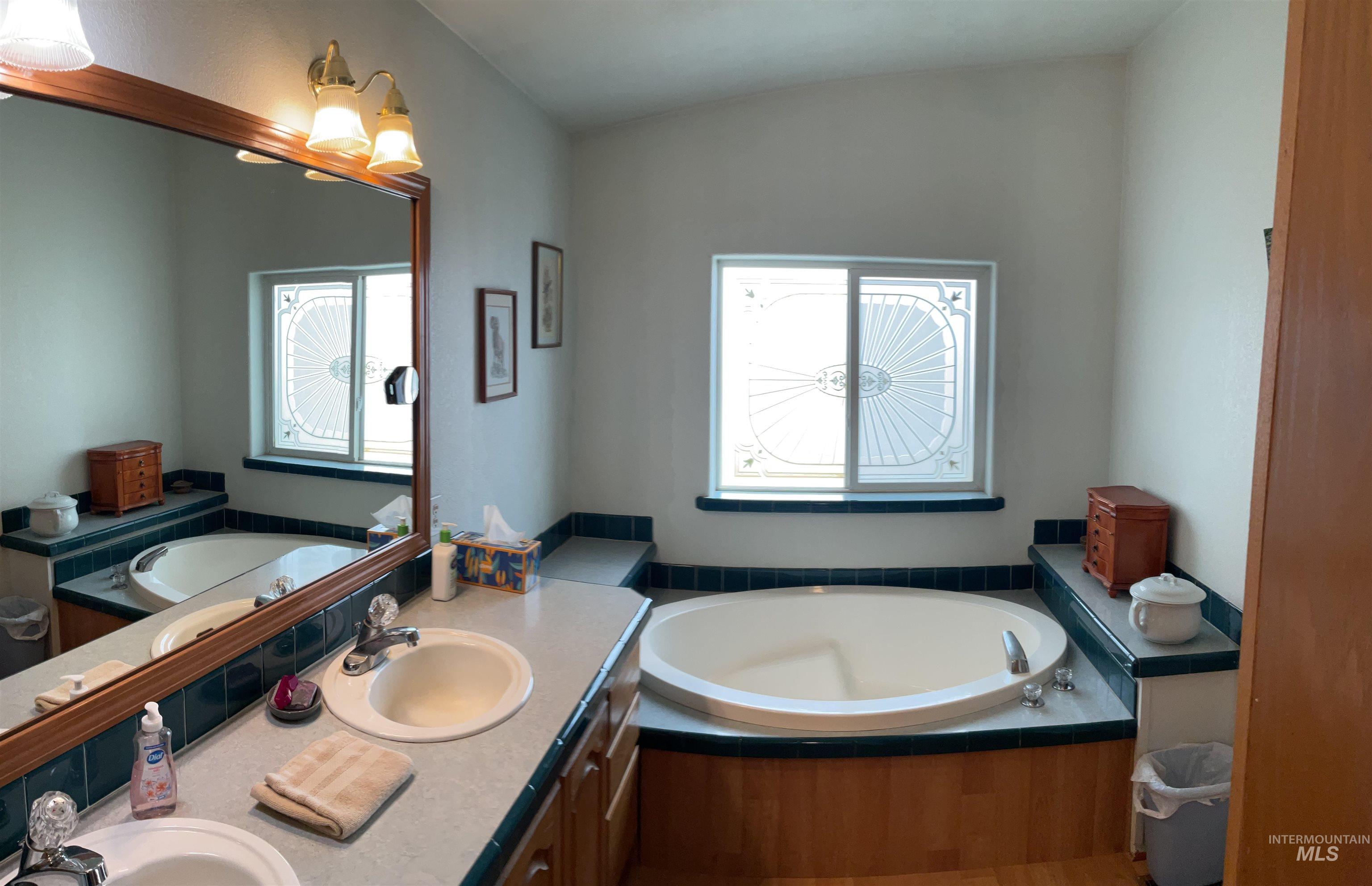 10749 Upper Fords Creek Road Orofino, ID 83544 - Photo 45 of 45 Bathroom with a bath and double vanity