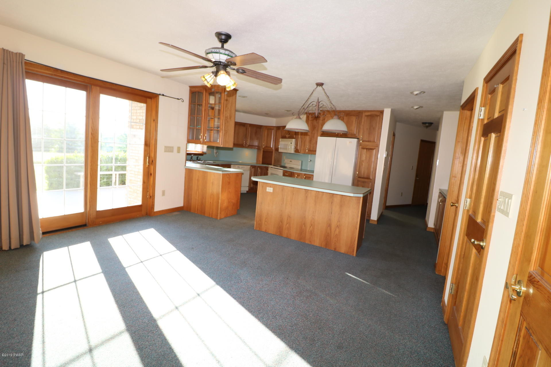 53 Savitz Road Lake Ariel, PA 18436 - Photo 20 of 53 a view of a kitchen with a sink cabinet a kitchen wooden floor and a window