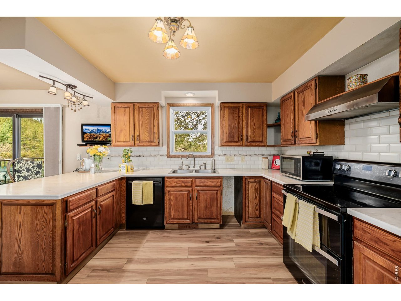 37 High View Lane Boulder, CO 80302 - Photo 15 of 50 a kitchen with stainless steel appliances granite countertop a stove a sink dishwasher and a microwave oven with cabinets