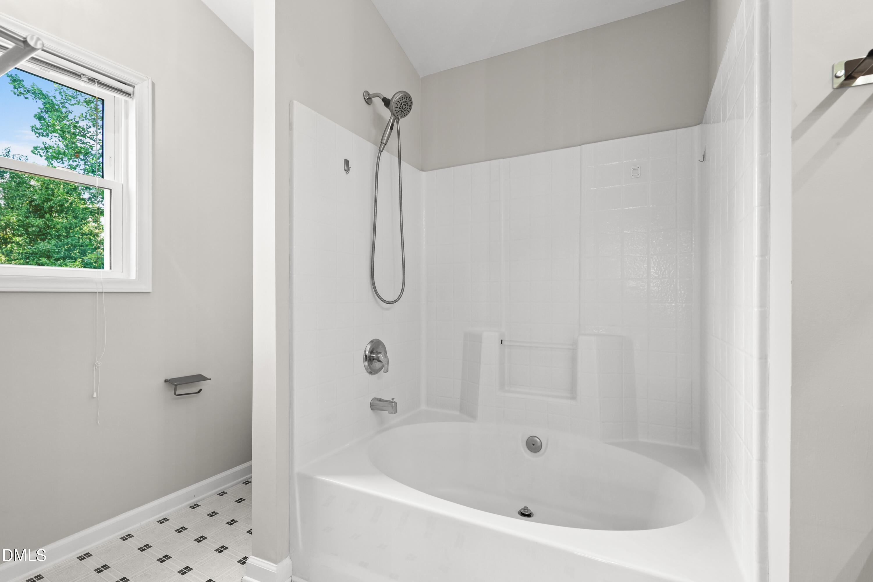 3015 Rennit Court Raleigh, NC 27603 - Photo 23 of 40 a white bath tub sitting next to a shower