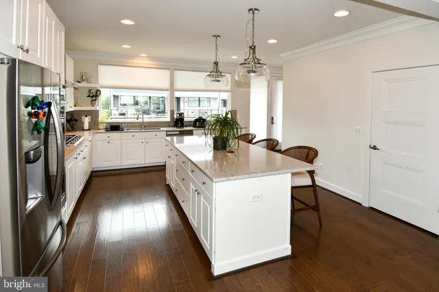 a bathroom with a toilet a sink and a mirror