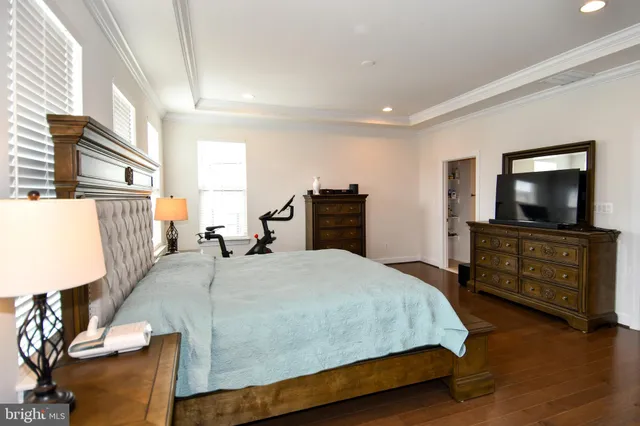 a bathroom with a shower and a glass door