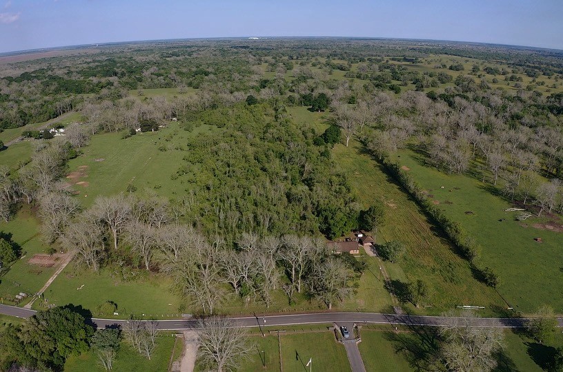 0 County Road 42 Rosharon, TX 77583 - Photo 2 of 14 a view of a lake with a mountain in the background