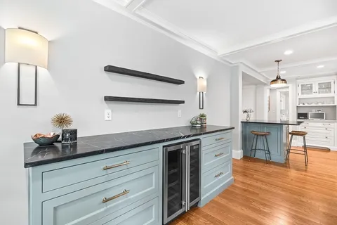 a kitchen with stainless steel appliances granite countertop a sink and cabinets
