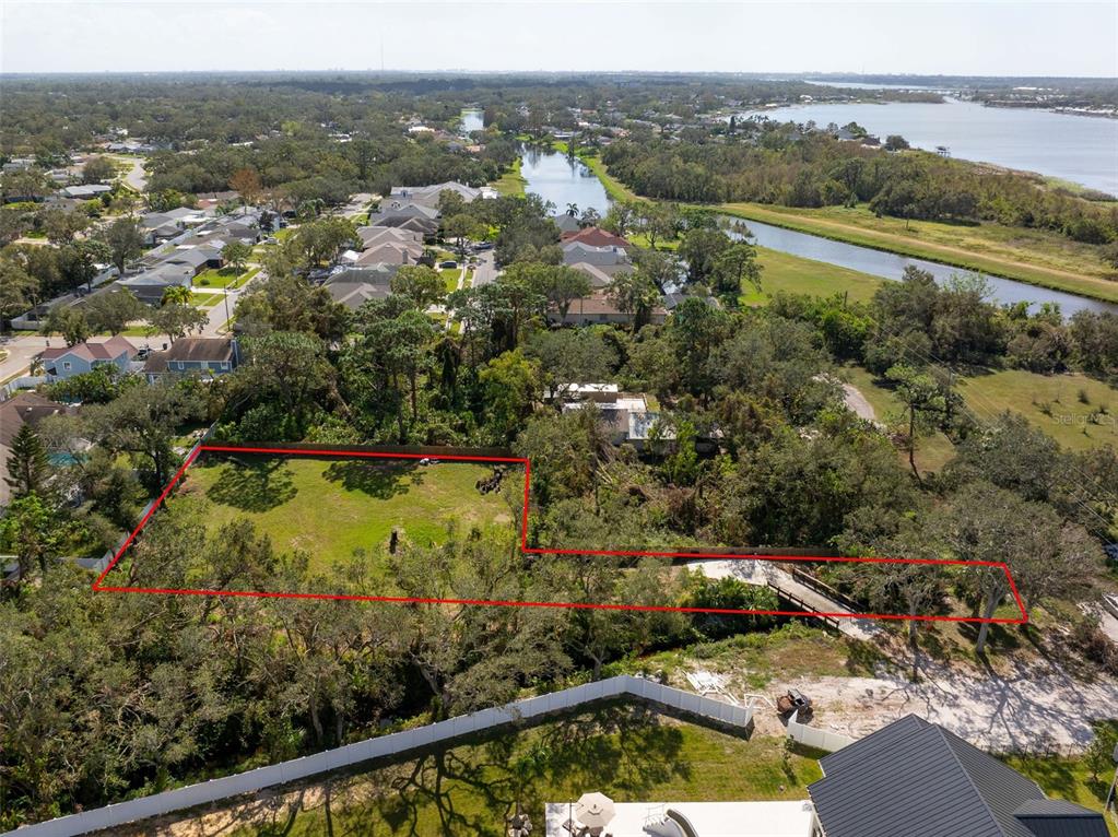 12295 95th Street North Largo, FL 33773 - Photo 11 of 23 an aerial view of lake residential house with outdoor space and swimming pool
