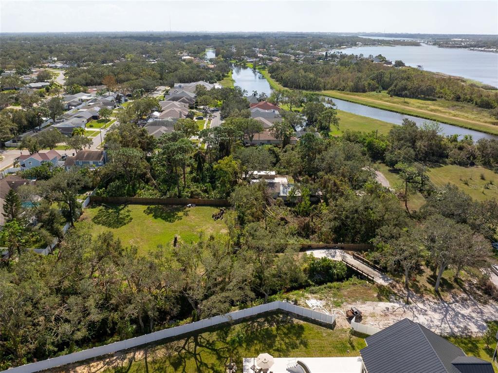 12295 95th Street North Largo, FL 33773 - Photo 12 of 23 an aerial view of residential houses with outdoor space and river