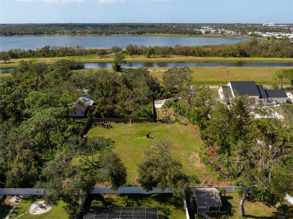 12295 95th Street North Largo, FL 33773 - Photo 18 of 23 a view of a lake with a houses