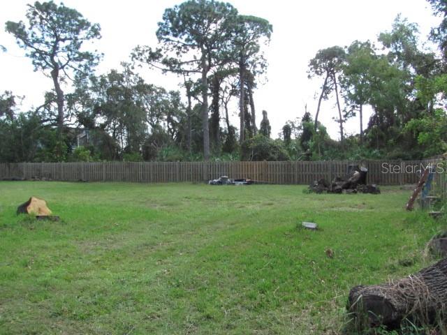 12295 95th Street North Largo, FL 33773 - Photo 22 of 23 a view of outdoor space with deck and yard