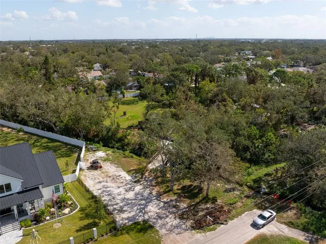 an aerial view of house with yard