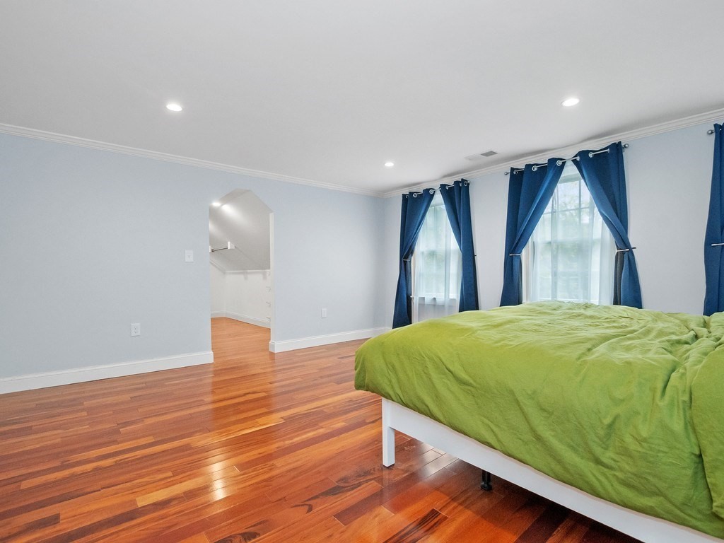 1767 Trapelo Road Waltham, MA 02451 - Photo 16 of 39 a bed sitting in a bedroom next to a window