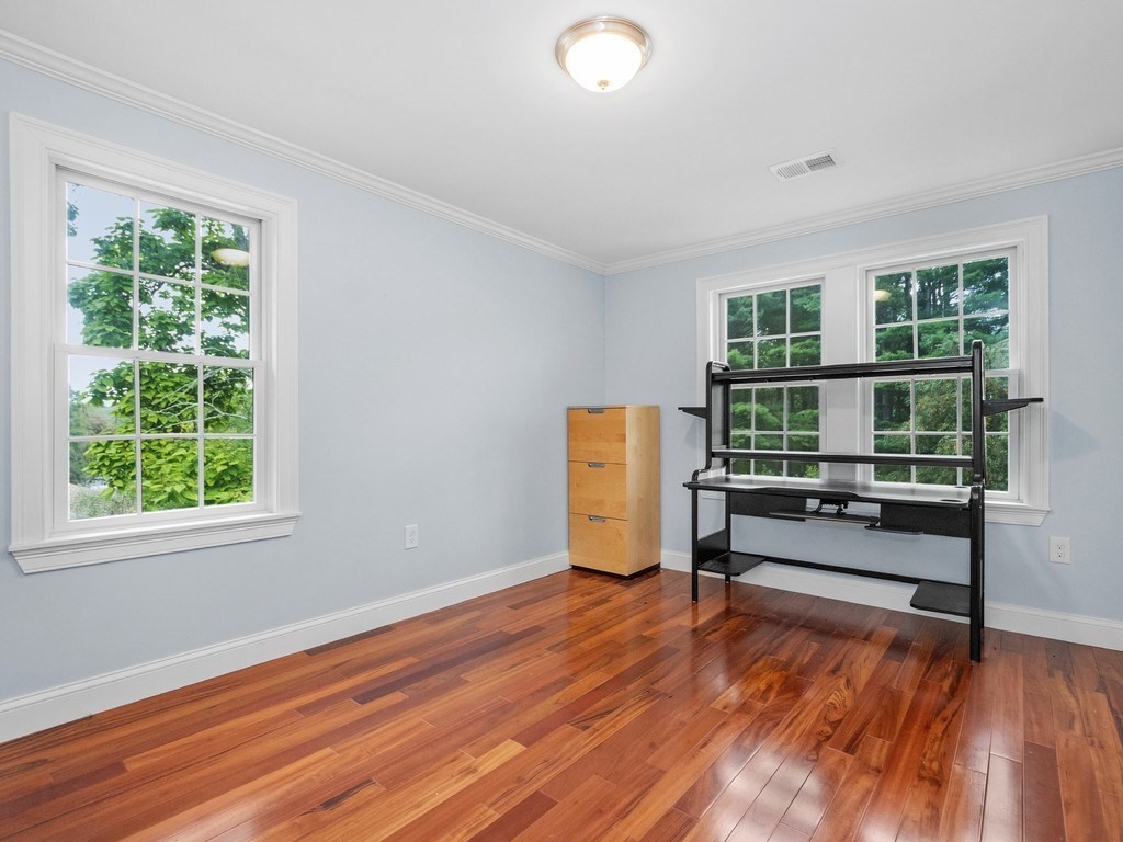 1767 Trapelo Road Waltham, MA 02451 - Photo 17 of 39 wooden floor in an empty room with a window