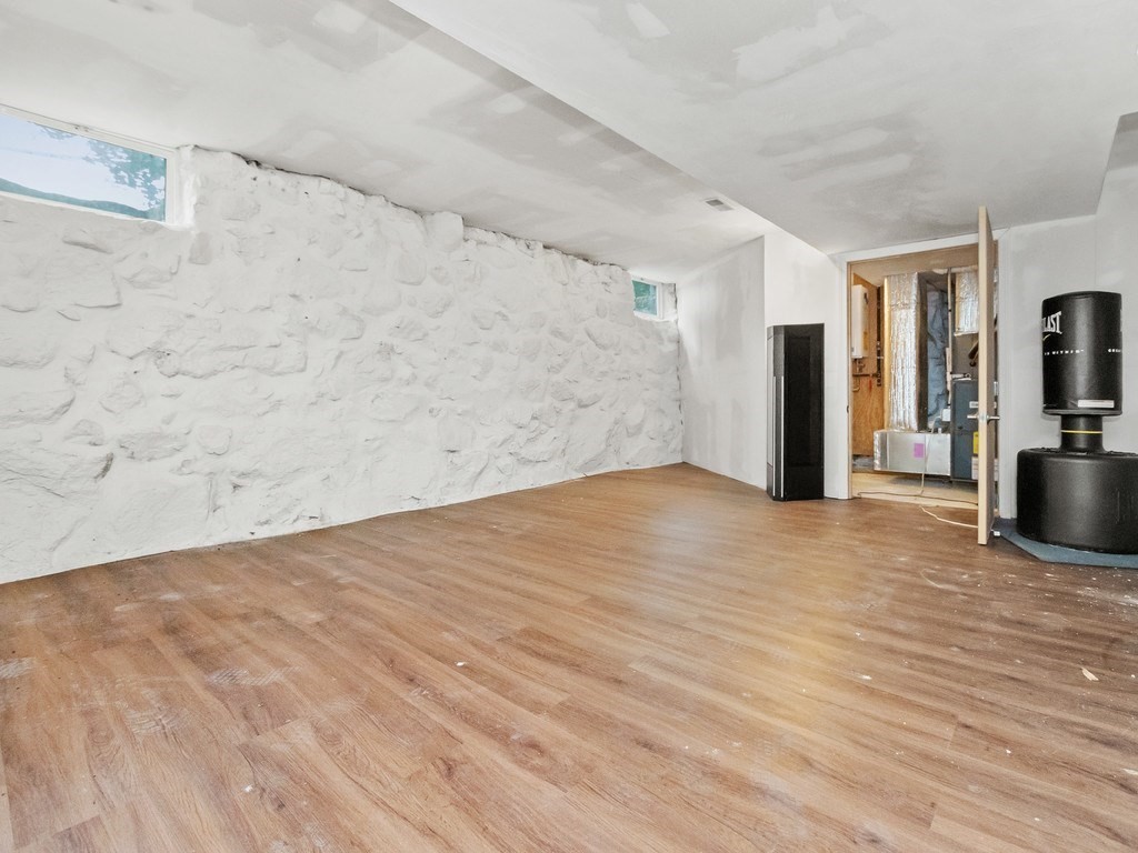 1767 Trapelo Road Waltham, MA 02451 - Photo 28 of 39 a view of empty room with wooden floor