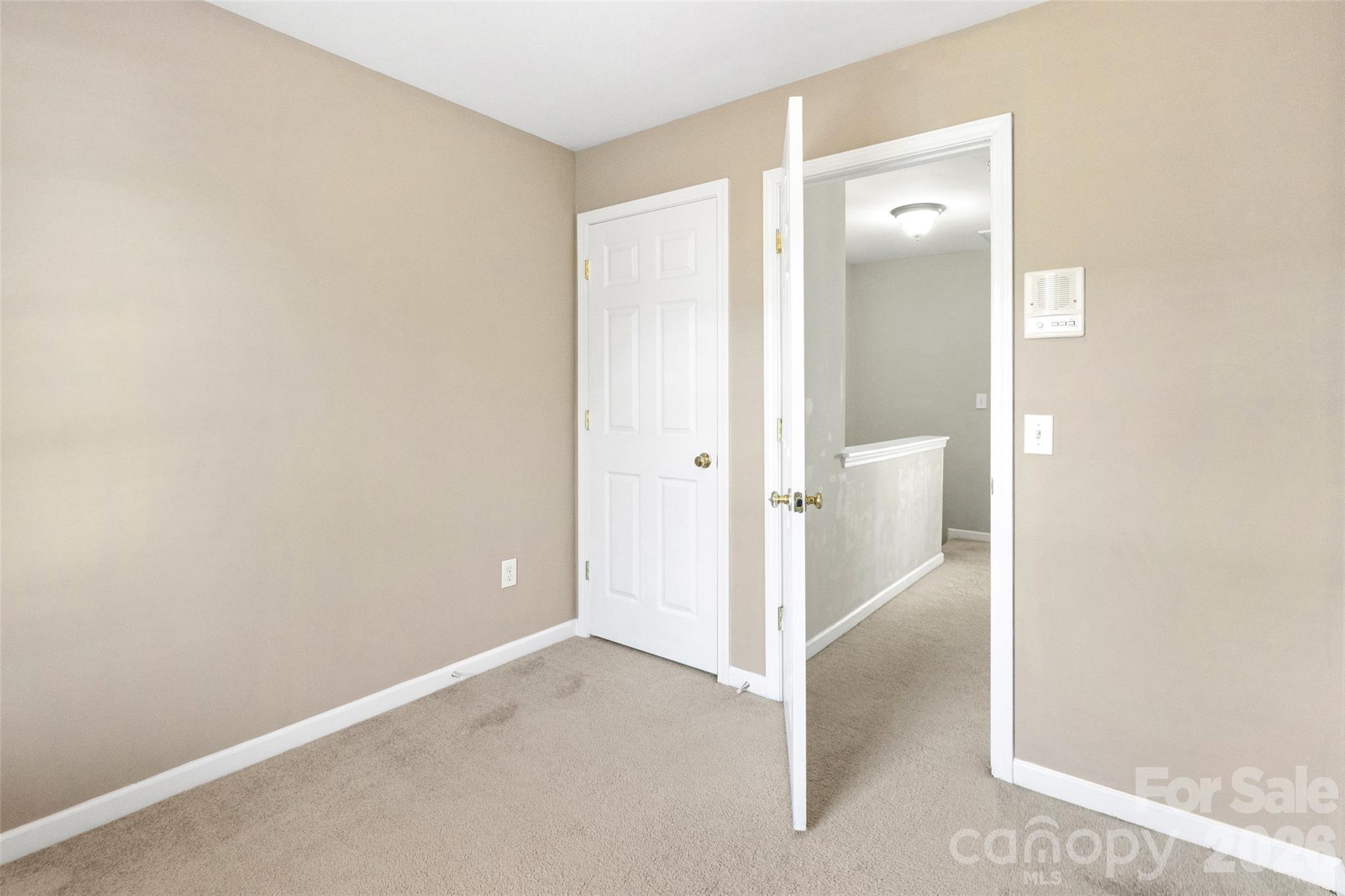 104 Rock Ridge Lane Mount Holly, NC 28120 - Photo 38 of 48 an empty room with an entrance to other room