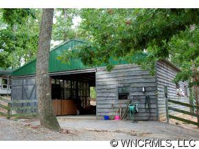 300 Upper Ridgeview Road Columbus, NC 28722 - Photo 4 of 12 a backyard of a house with seating space