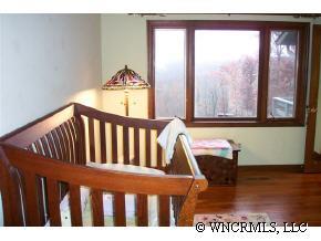 300 Upper Ridgeview Road Columbus, NC 28722 - Photo 8 of 12 a view of a black and white wooden floor