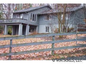 300 Upper Ridgeview Road Columbus, NC 28722 - Photo 10 of 12 a front view of a house with a yard