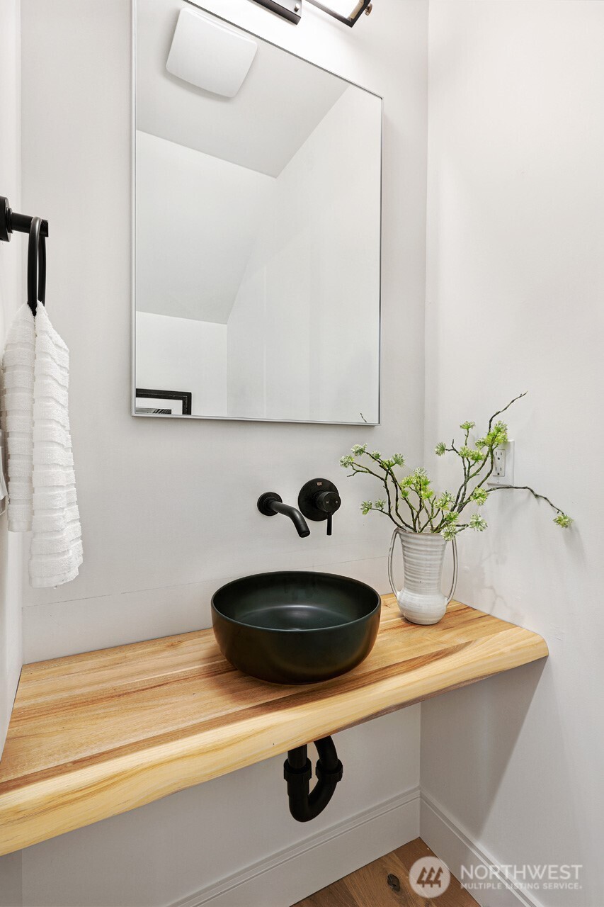 2006 B 19th Avenue South Seattle, WA 98144 - Photo 16 of 32 a bathroom with a sink and a mirror
