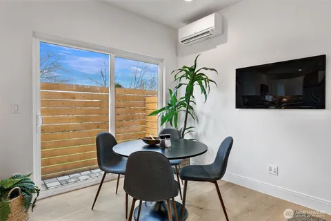 a view of a livingroom with furniture and a flat screen tv