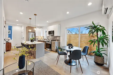 a kitchen with a table and chairs