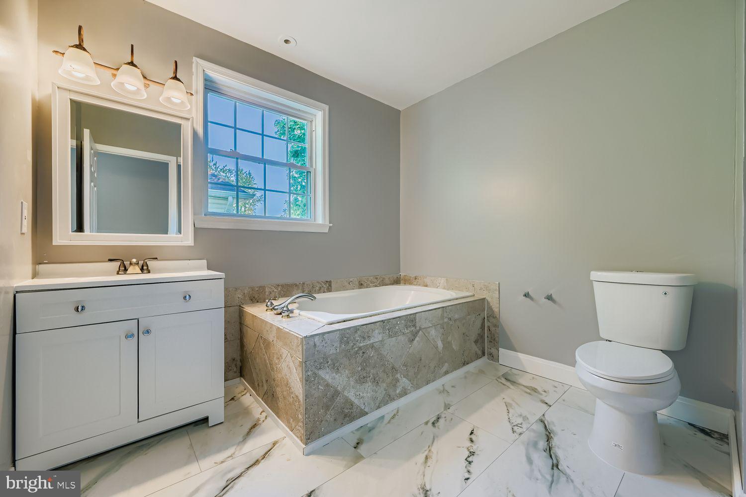 3415 Springdale Avenue Baltimore, MD 21216 - Photo 19 of 33 Hall Bathroom with Soaking Tub
