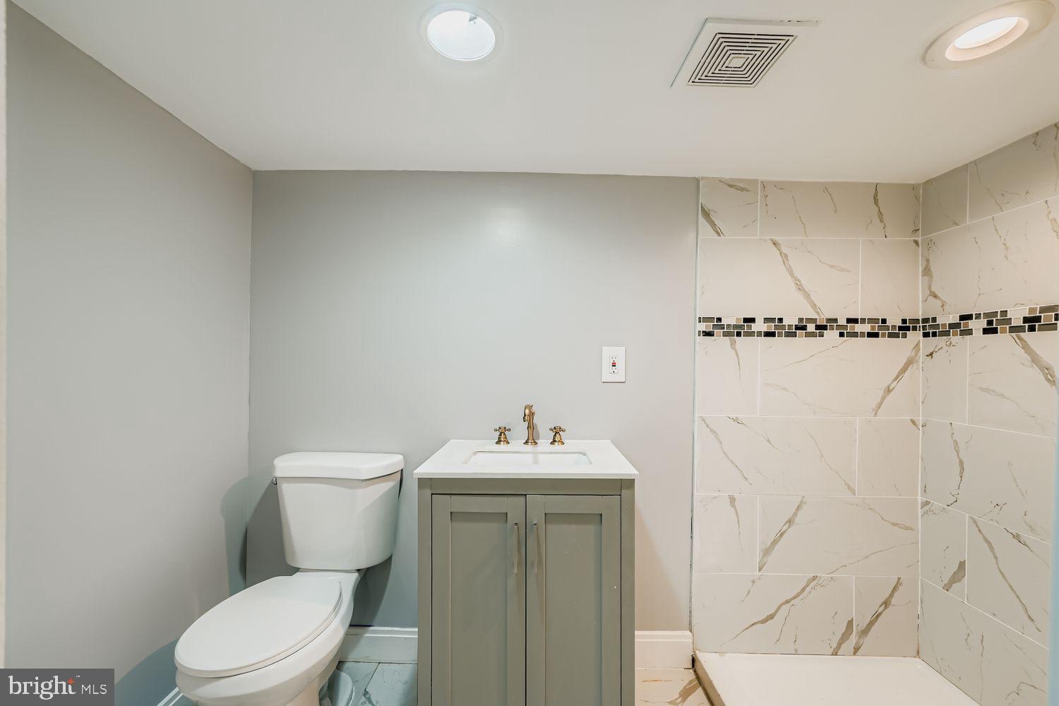3415 Springdale Avenue Baltimore, MD 21216 - Photo 23 of 33 Full Basement Bathroom with Marble Tiling
