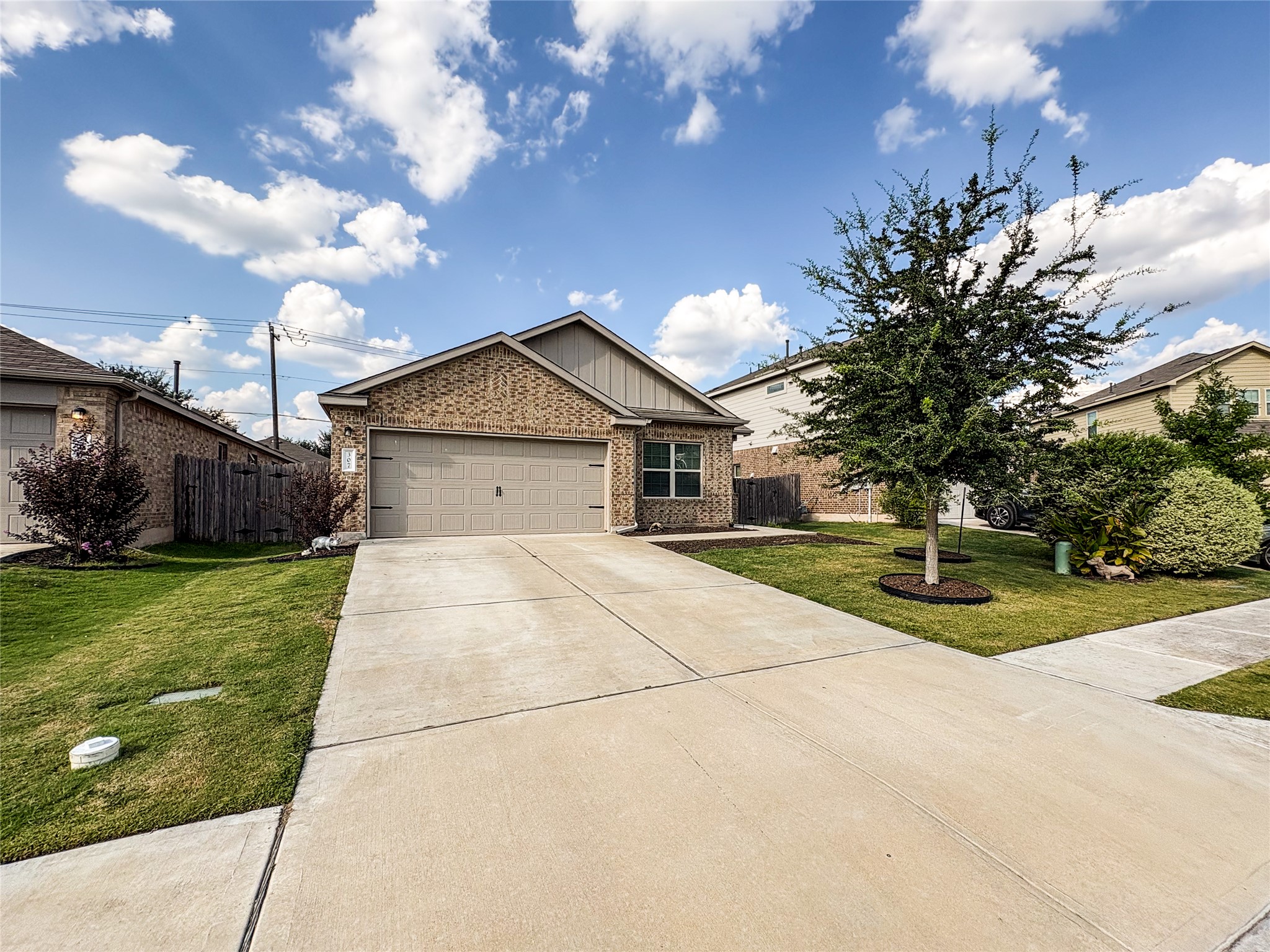 307 Andesite Trail Buda, TX 78610 - Photo 1 of 19 a front view of house with yard