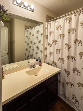 a bathroom with a double vanity sink and mirror