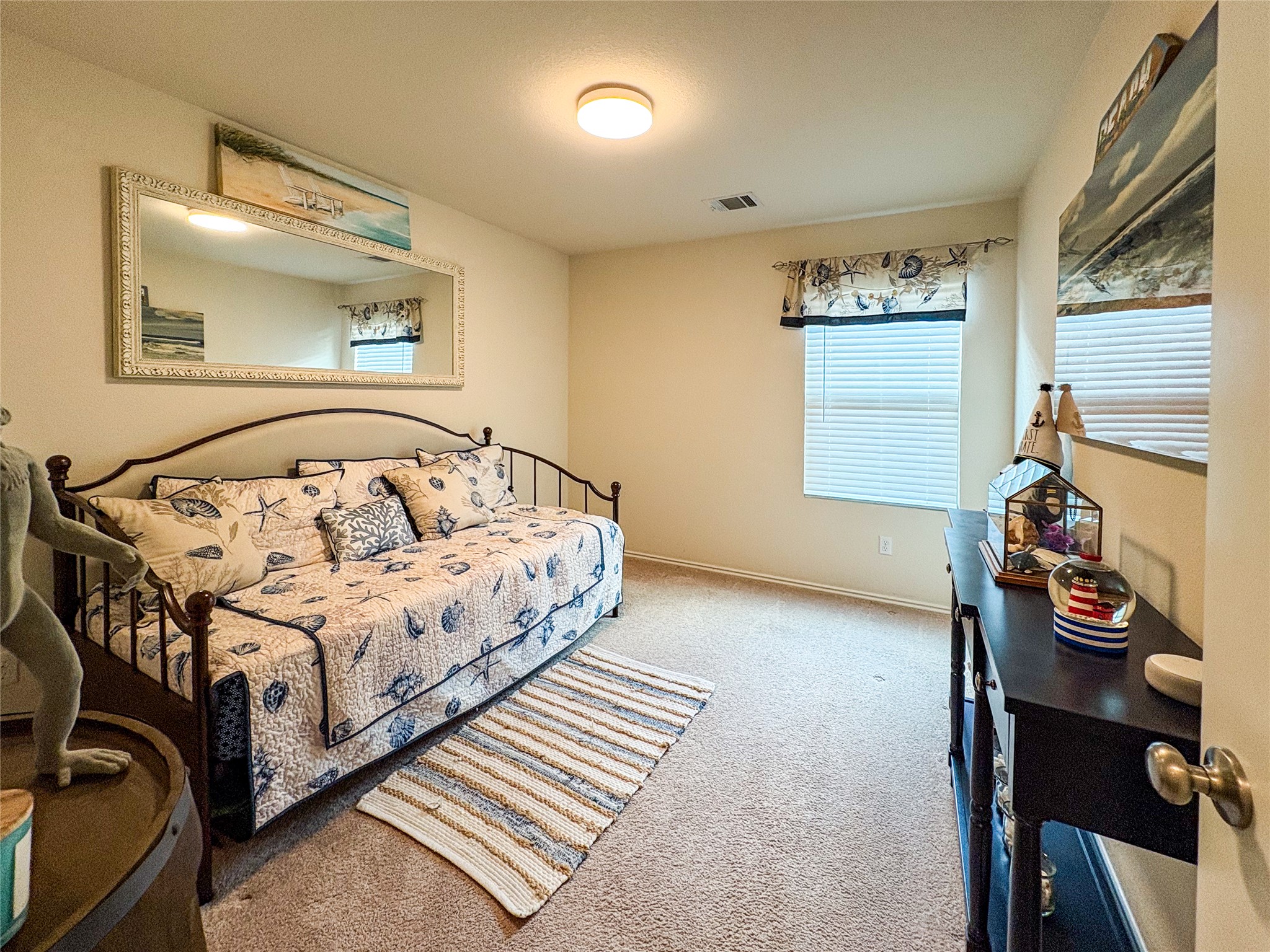 307 Andesite Trail Buda, TX 78610 - Photo 13 of 19 a bedroom with a bed and a window