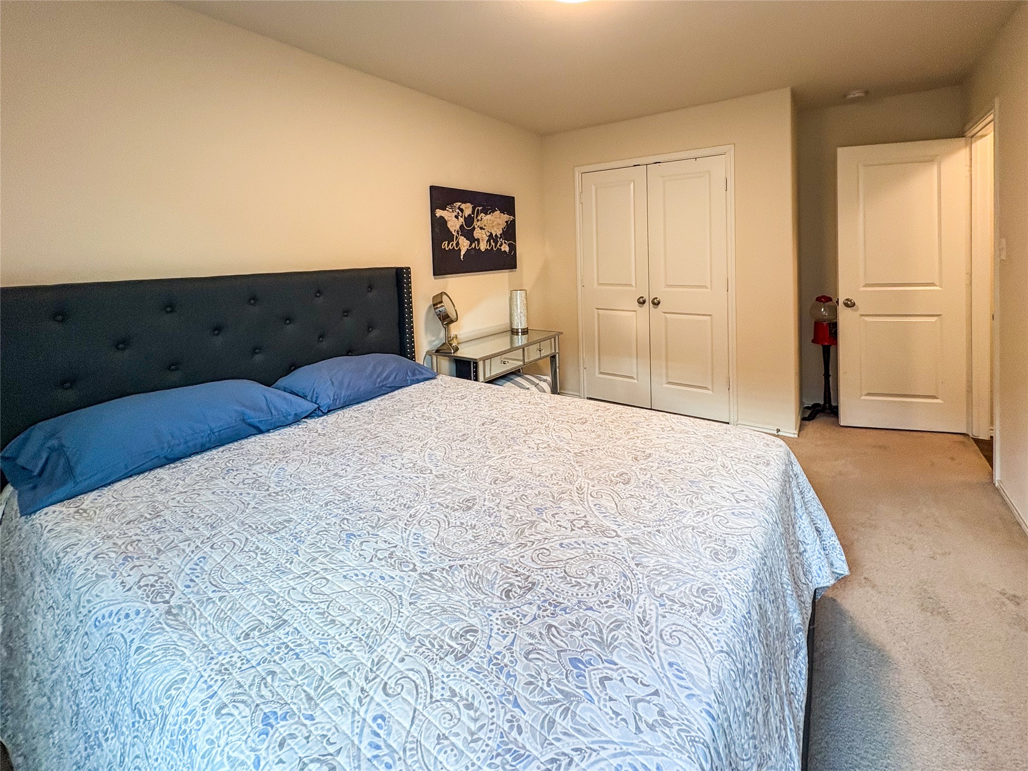 307 Andesite Trail Buda, TX 78610 - Photo 15 of 19 a bedroom with a bed and cabinets