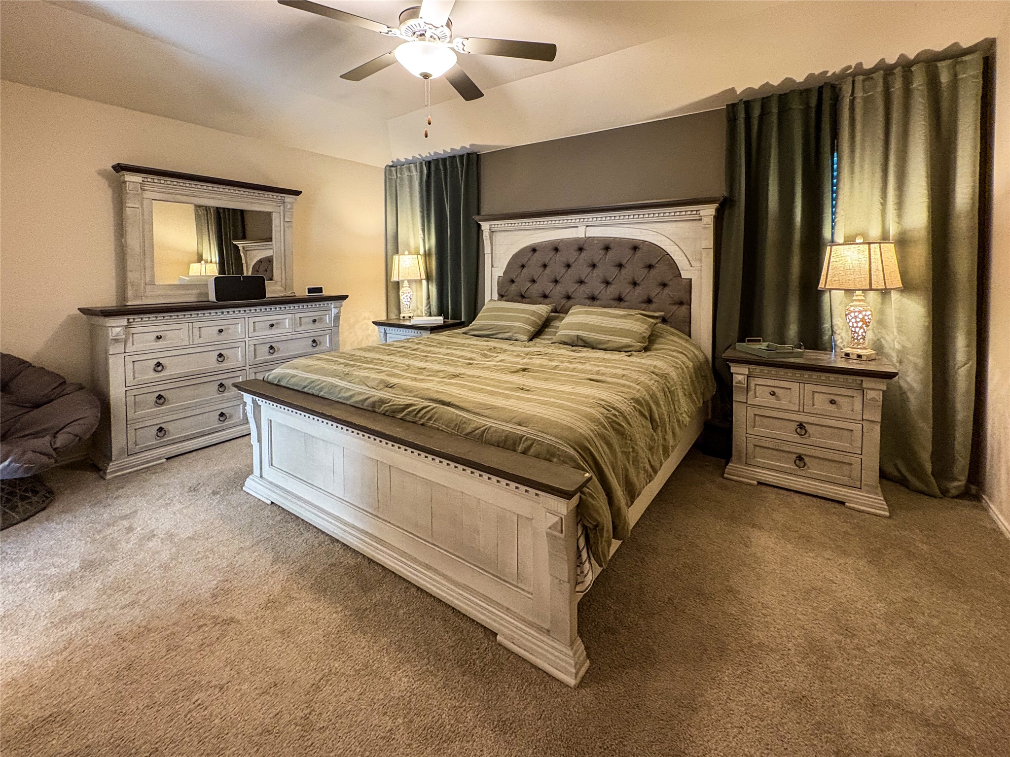 307 Andesite Trail Buda, TX 78610 - Photo 7 of 19 a spacious bedroom with a bed and a flat screen television