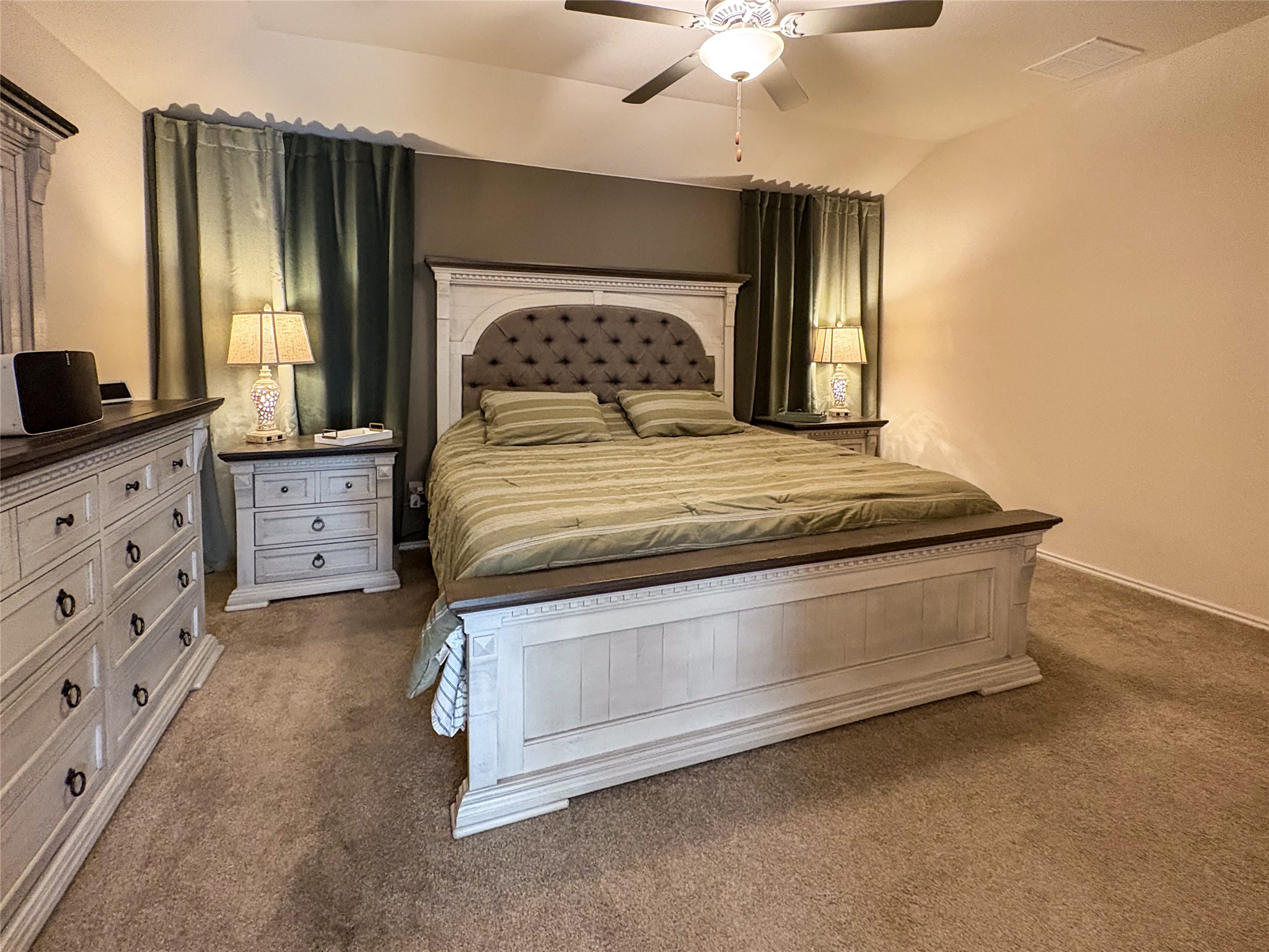 307 Andesite Trail Buda, TX 78610 - Photo 8 of 19 a bedroom with a bed and a chandelier