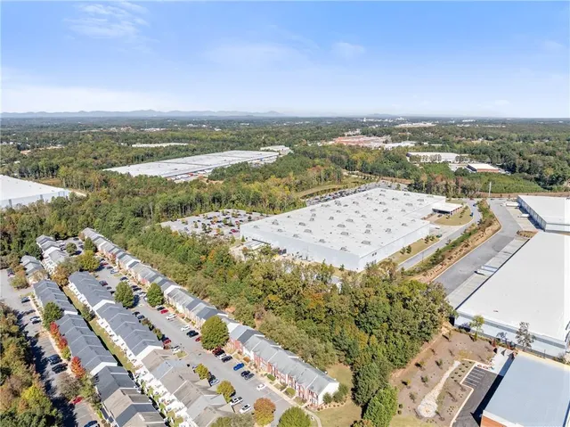 an aerial view of residential building and lake