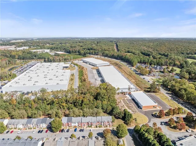 an aerial view of residential houses with outdoor space