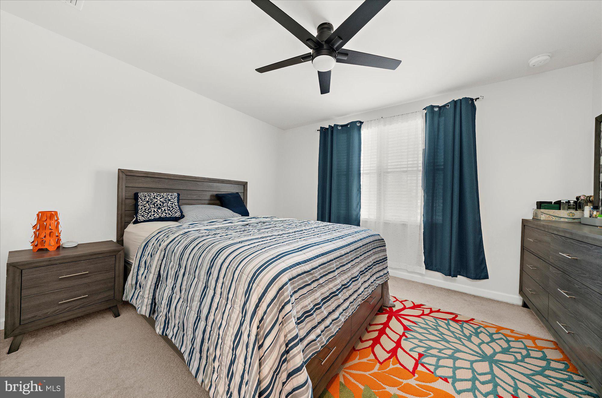 39 Wendowski Street Beverly, NJ 08010 - Photo 12 of 25 a bedroom with a bed and a dresser