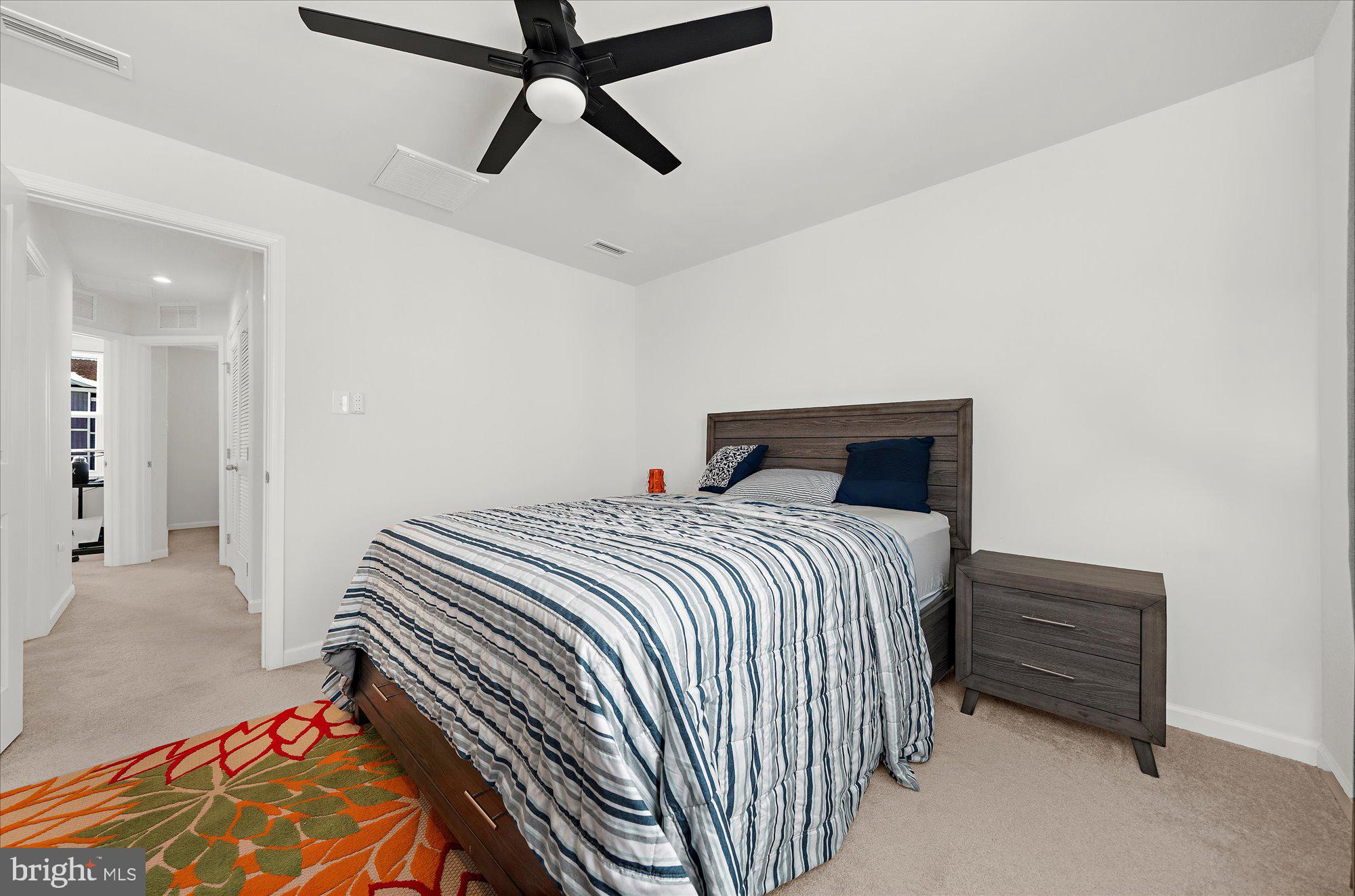 39 Wendowski Street Beverly, NJ 08010 - Photo 13 of 25 a bedroom with a bed and a chandelier