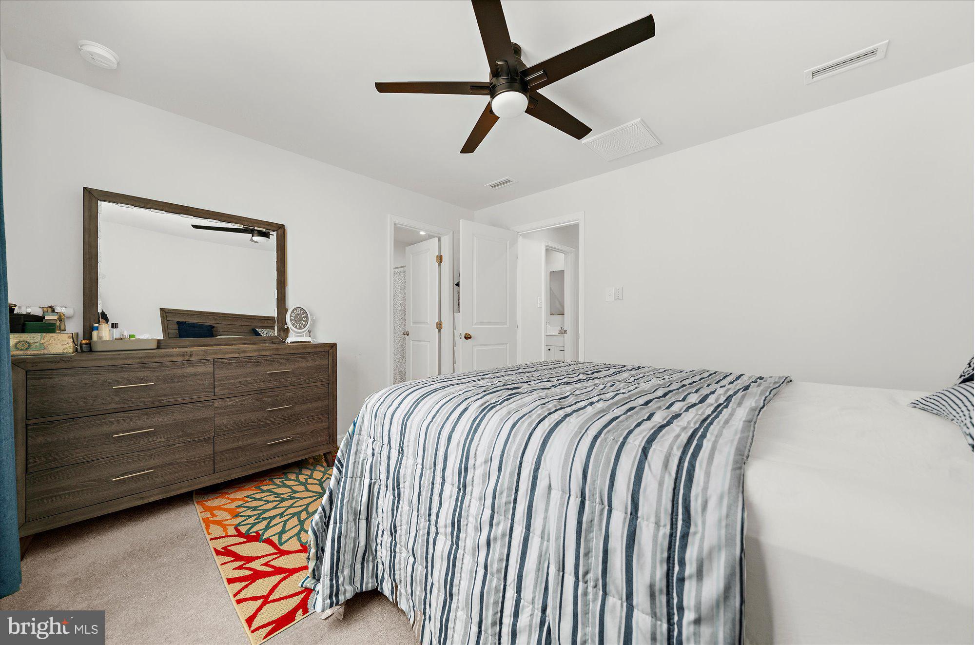 39 Wendowski Street Beverly, NJ 08010 - Photo 14 of 25 a bed room with a bed and a dresser