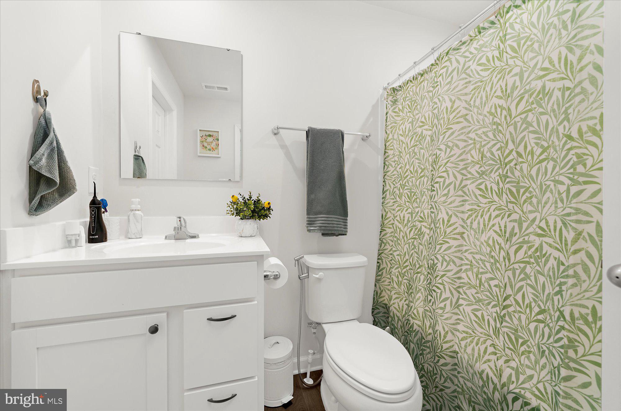 39 Wendowski Street Beverly, NJ 08010 - Photo 15 of 25 a bathroom with a sink a toilet and a mirror